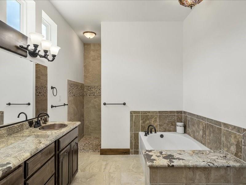 6969 Highway 198 Canton, TX 75103 - Photo 30 of 40 a bathroom with a granite countertop sink and a mirror