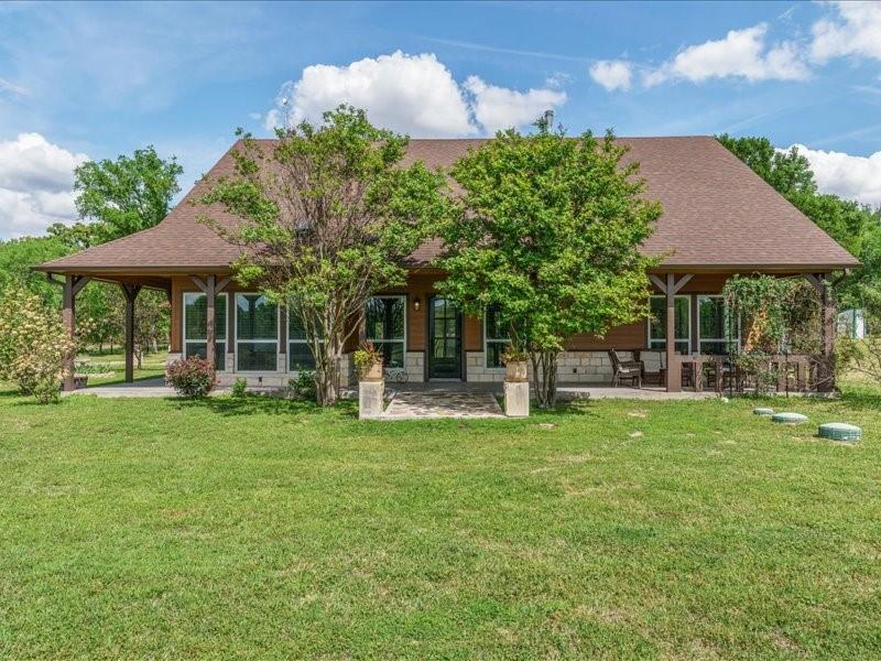 6969 Highway 198 Canton, TX 75103 - Photo 9 of 40 a view of a house with backyard sitting area and garden