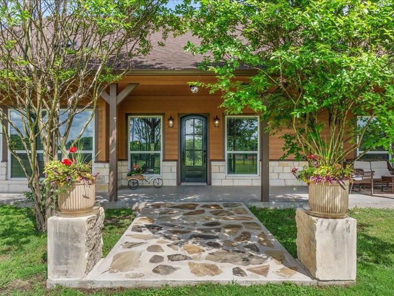 6969 Highway 198 Canton, TX 75103 - Photo 10 of 40 a front view of a house with garden