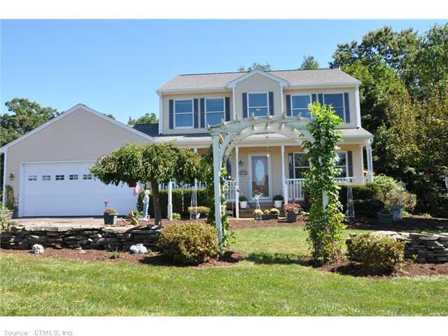 12 Oldfield Road Granby, CT 06035 - Photo 1 of 1 a front view of a house with a yard