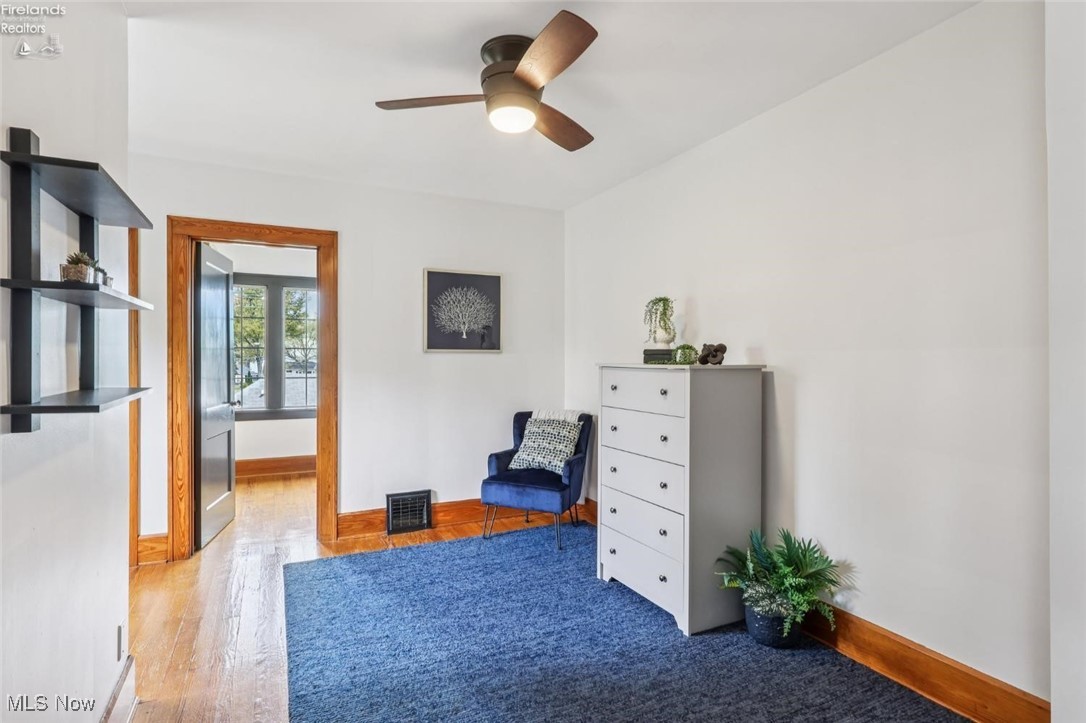 1208 Cleveland Road West Huron, OH 44839 - Photo 13 of 30 Bedroom with wood finished floors and a ceiling fan