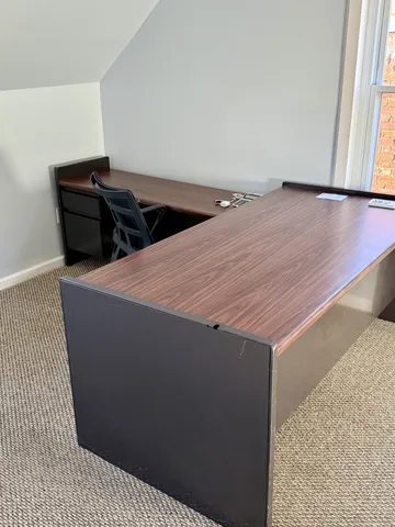 an empty room with a empty space and windows