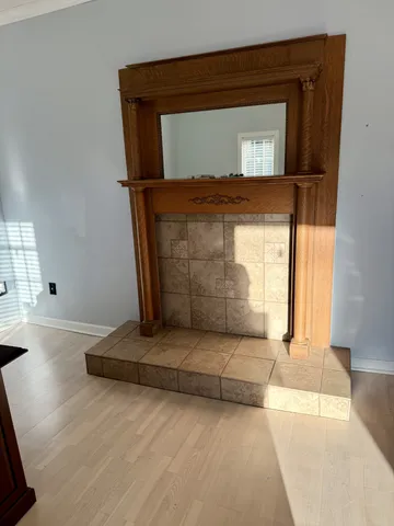 a bathroom with a shower and mirror