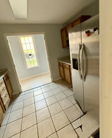 a view of a hallway view with wooden floor and staircase
