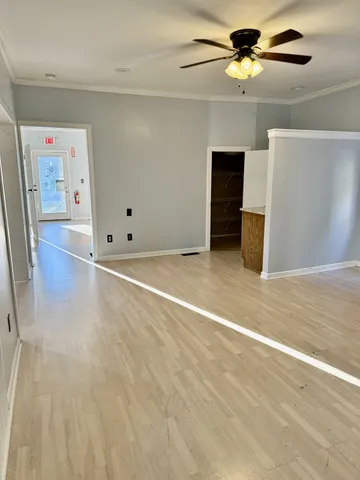 a view of an empty room with a window