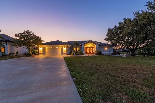 a front view of house with garden
