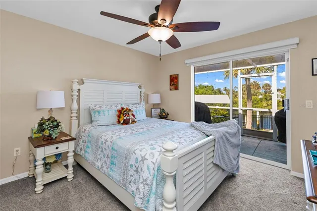 a bedroom with furniture and a flat screen tv
