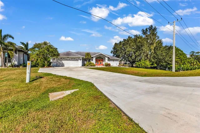a view of house with outdoor space and sitting area