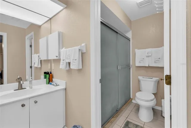 a view of a patio with a table and chairs under an umbrella