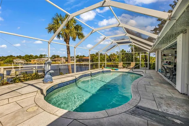 a view of a yard with swimming pool