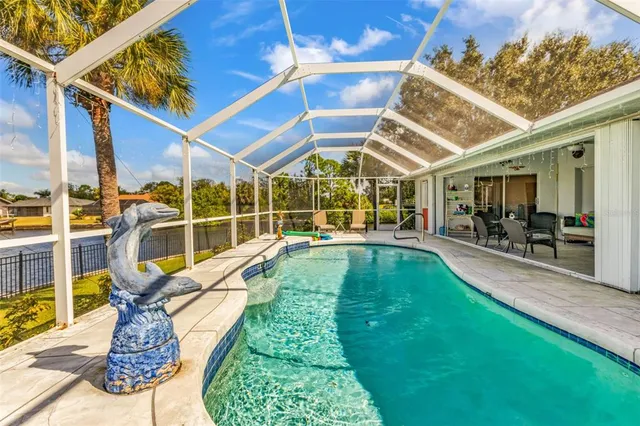 a view of a swimming pool with a patio