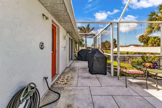 a view of a balcony with chairs