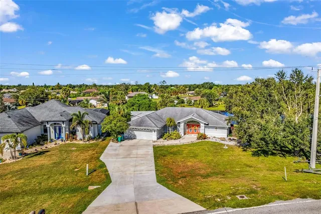 a view of a lake with a table and chairs