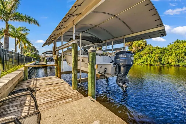 an aerial view of a wooden house with a swimming pool
