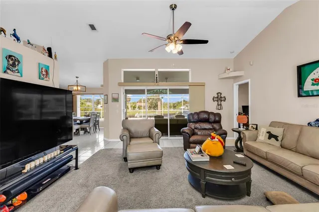 a view of a kitchen with fridge and workspace