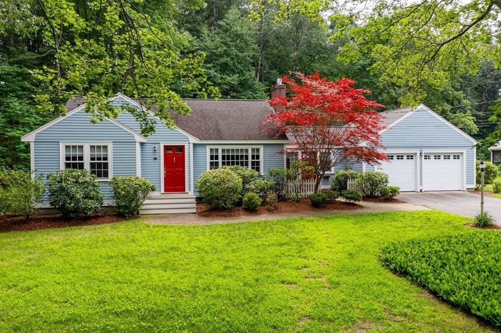 52 Edgewood Road Concord, MA 01742 - Photo 1 of 29 a front view of a house with a yard and trees