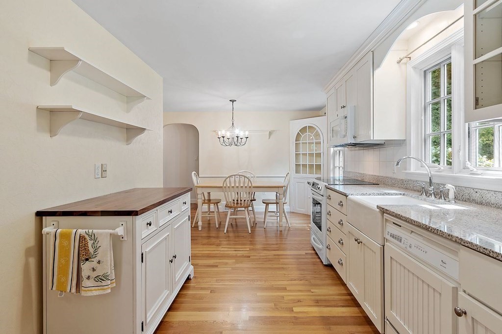 52 Edgewood Road Concord, MA 01742 - Photo 11 of 29 a kitchen with granite countertop a sink and cabinets