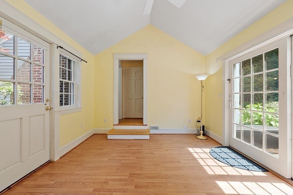 52 Edgewood Road Concord, MA 01742 - Photo 13 of 29 a view of an empty room with wooden floor and a window