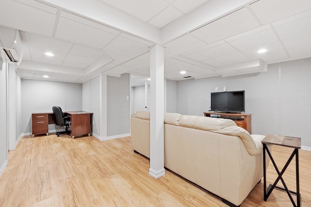 52 Edgewood Road Concord, MA 01742 - Photo 19 of 29 a living room with furniture and a flat screen tv