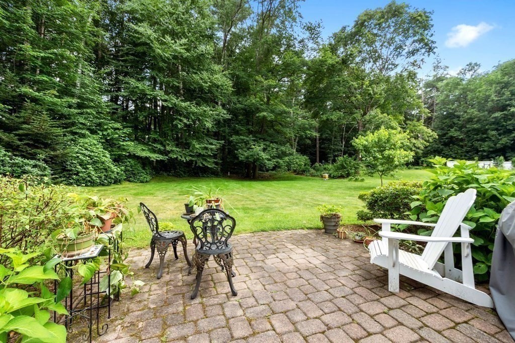 52 Edgewood Road Concord, MA 01742 - Photo 26 of 29 a view of an chairs and tables in the patio