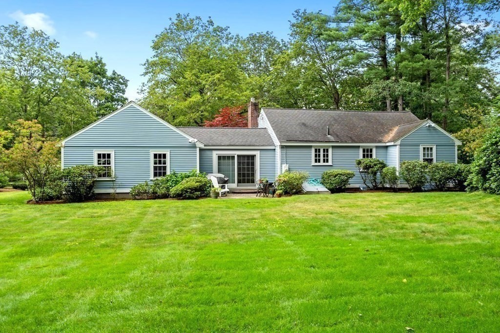 52 Edgewood Road Concord, MA 01742 - Photo 29 of 29 a front view of a house with a garden