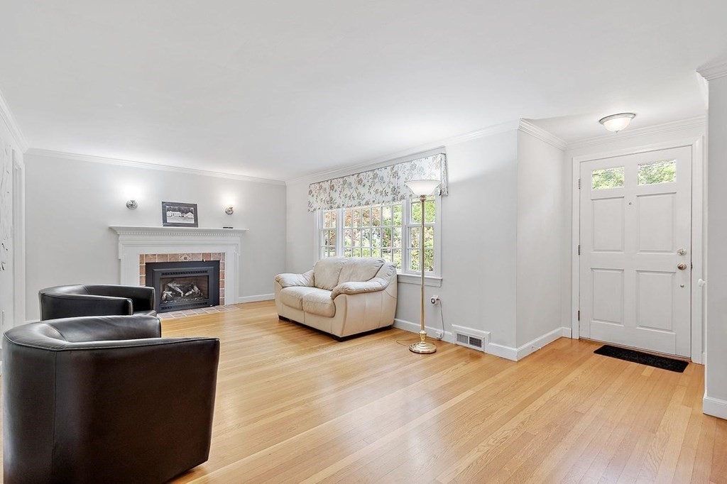 52 Edgewood Road Concord, MA 01742 - Photo 5 of 29 a living room with furniture and a fireplace