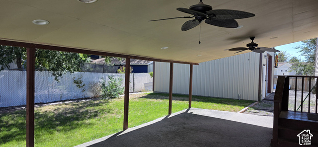 2989 Rae Street West Valley City, UT 84120 - Photo 17 of 25 Covered patio with integrated ceiling fans and recessed lighting, featuring a concrete surface and direct access to a fenced yard