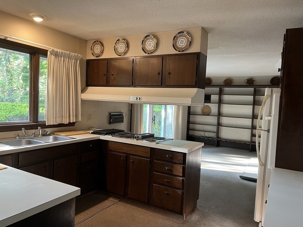 325 Marion Road Wareham, MA 02571 - Photo 11 of 29 a kitchen with a sink and cabinets