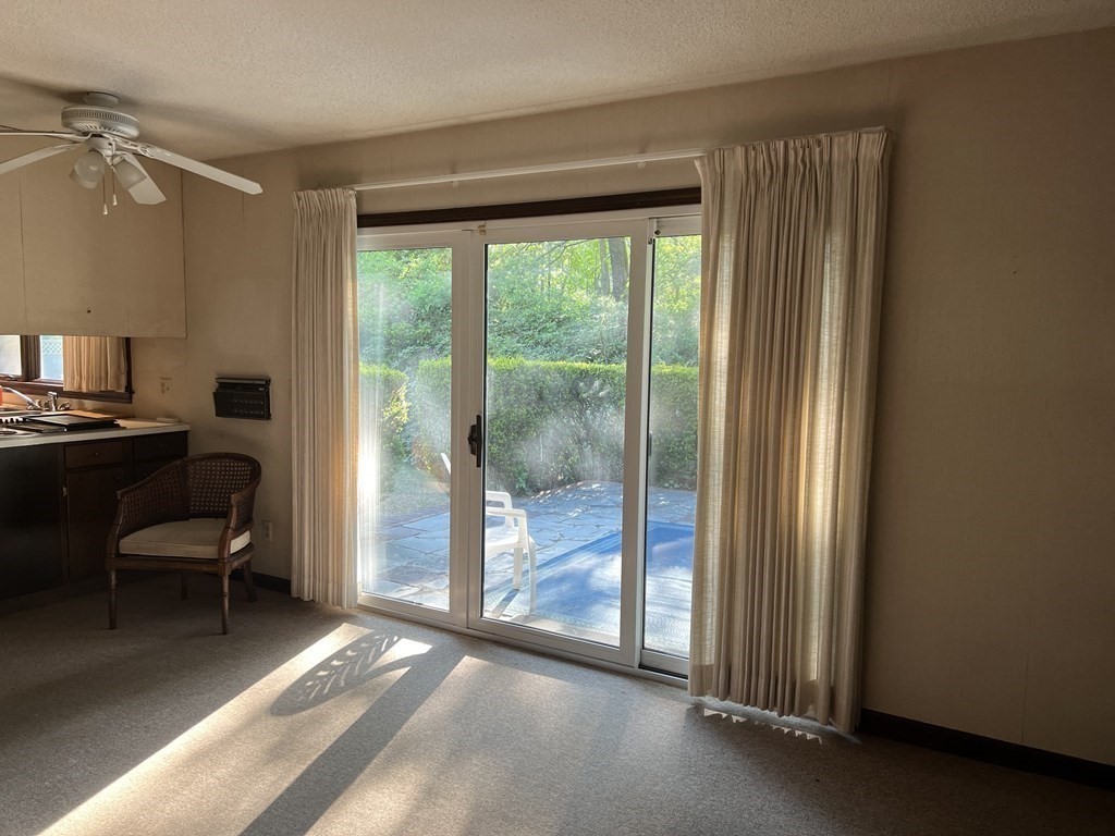 325 Marion Road Wareham, MA 02571 - Photo 13 of 29 a view of a room with a balcony bed and furniture