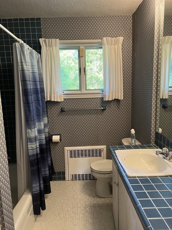 325 Marion Road Wareham, MA 02571 - Photo 17 of 29 a bathroom with a sink and a mirror