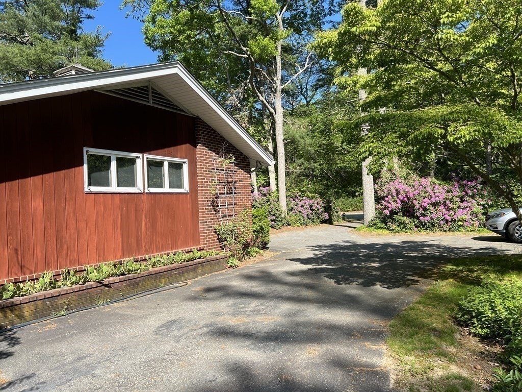 325 Marion Road Wareham, MA 02571 - Photo 6 of 29 a front view of a house with a yard and garage