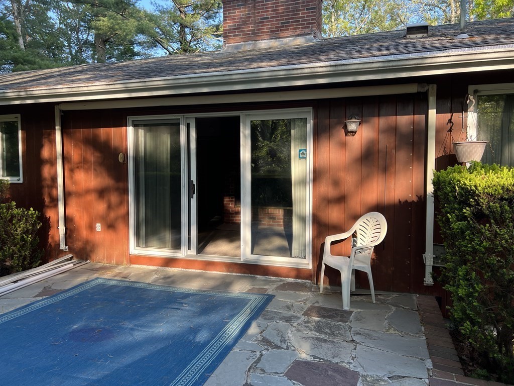 325 Marion Road Wareham, MA 02571 - Photo 8 of 29 a bench sitting in front of a building