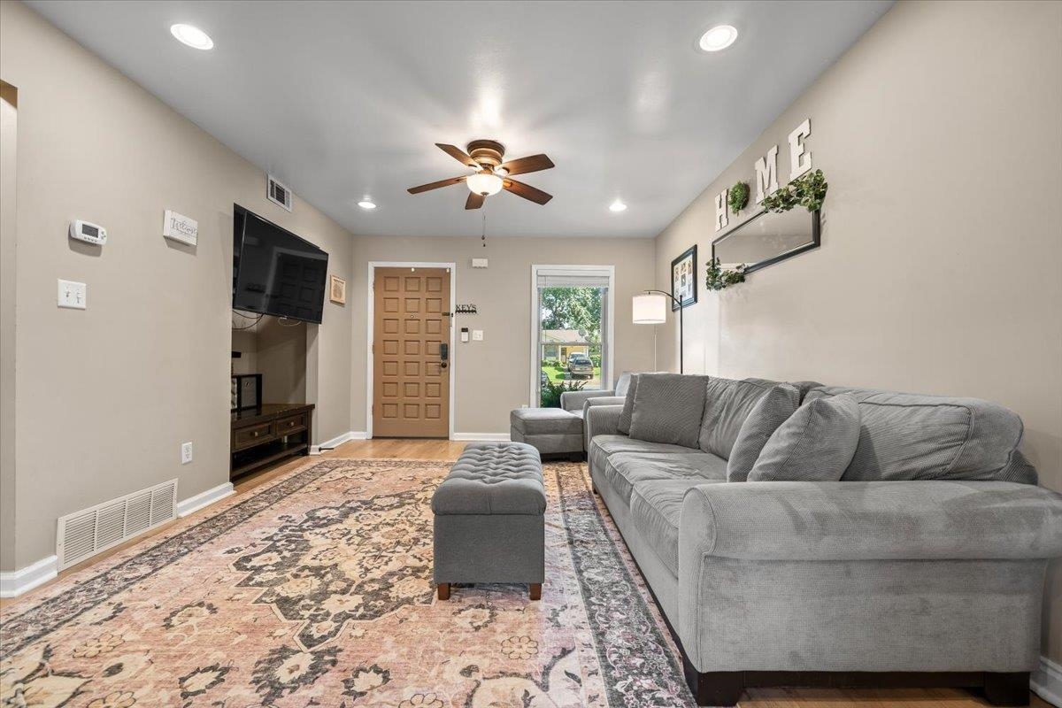 Living area featuring wood-finish flooring and neutral wall tones