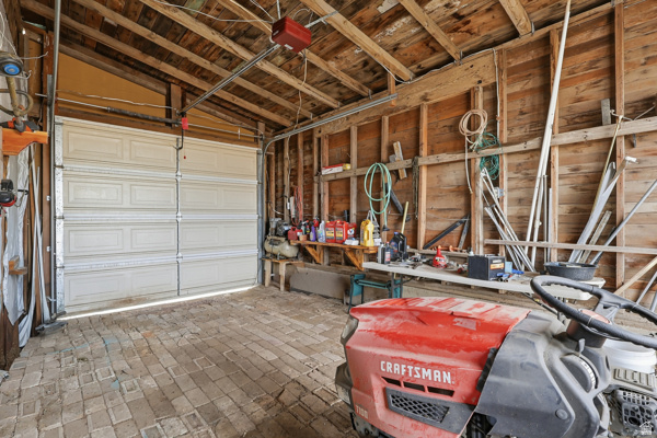 25615 Main Street Portage, UT 84331 - Photo 33 of 42 Garage featuring a garage door opener