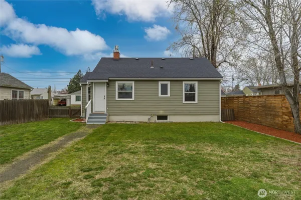 a backyard of a house with seating space