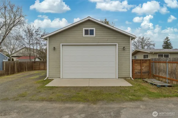 a front view of house with garage