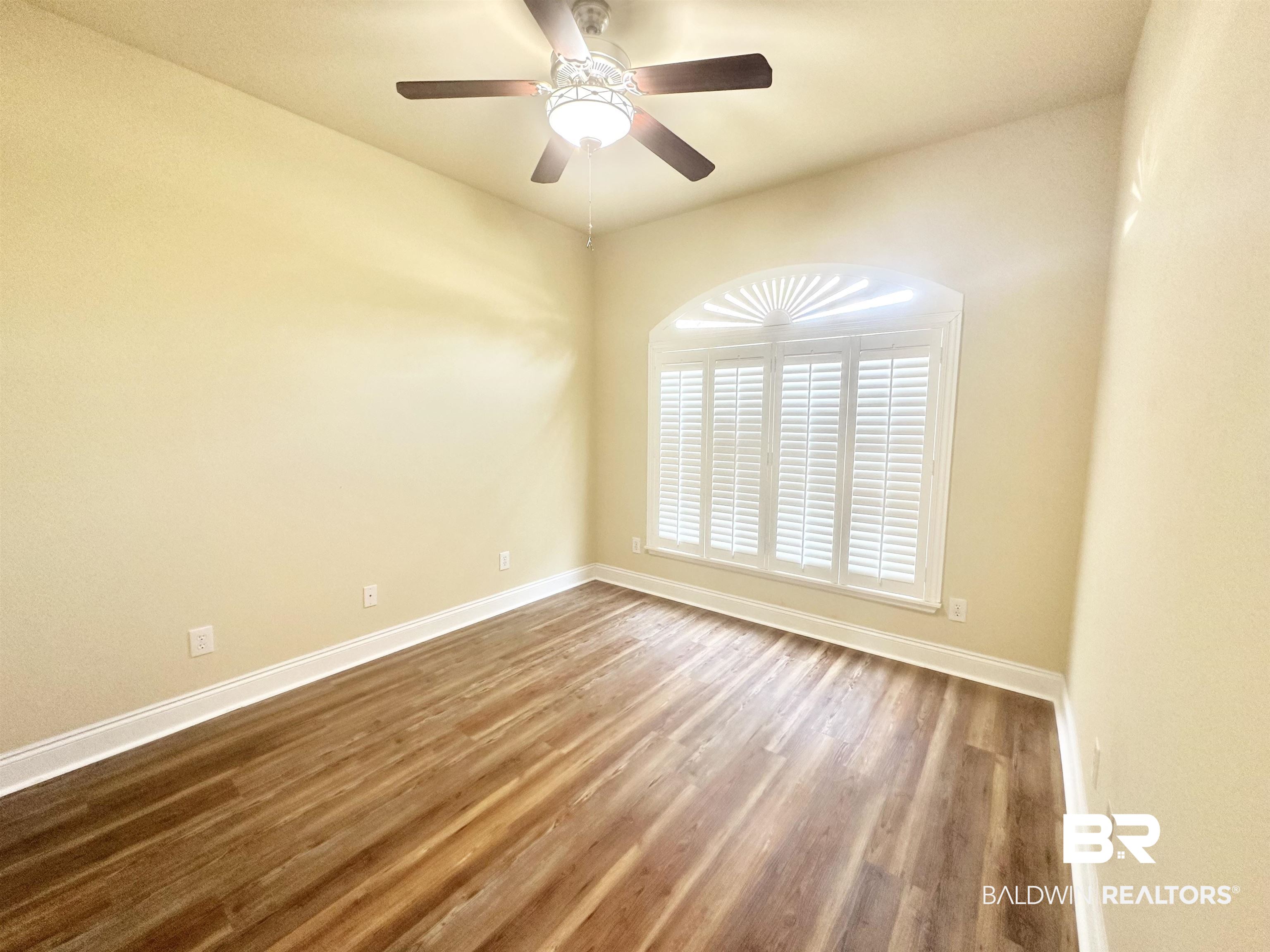 249 Hemingway Loop Foley, AL 36535 - Photo 16 of 33 Spare room with hardwood / wood-style floors and ceiling fan