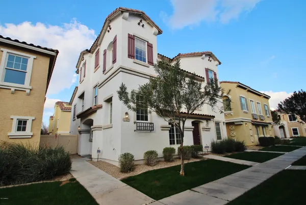a front view of a building with garden