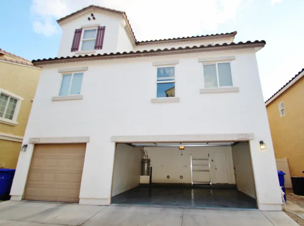 a view of a house with parking space