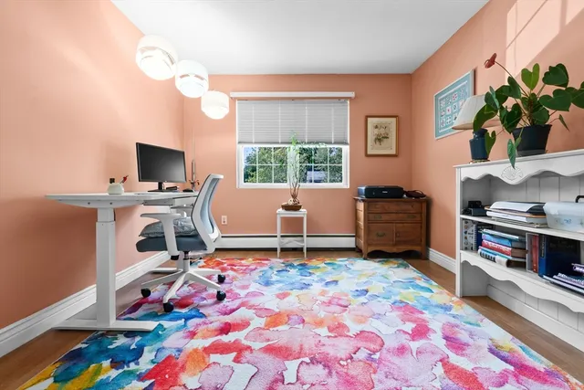 a workspace with furniture and a flat screen tv