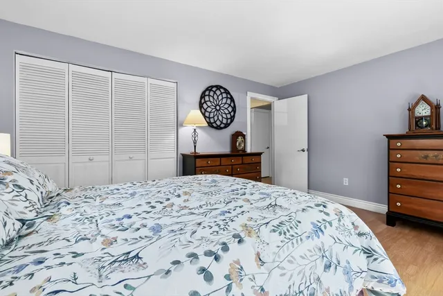 a bedroom with a bed and a table in it