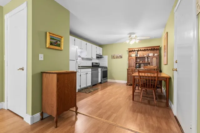 a kitchen with stainless steel appliances granite countertop a refrigerator and a stove top oven