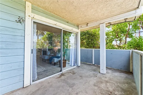 a view of a patio with swimming pool table and chairs