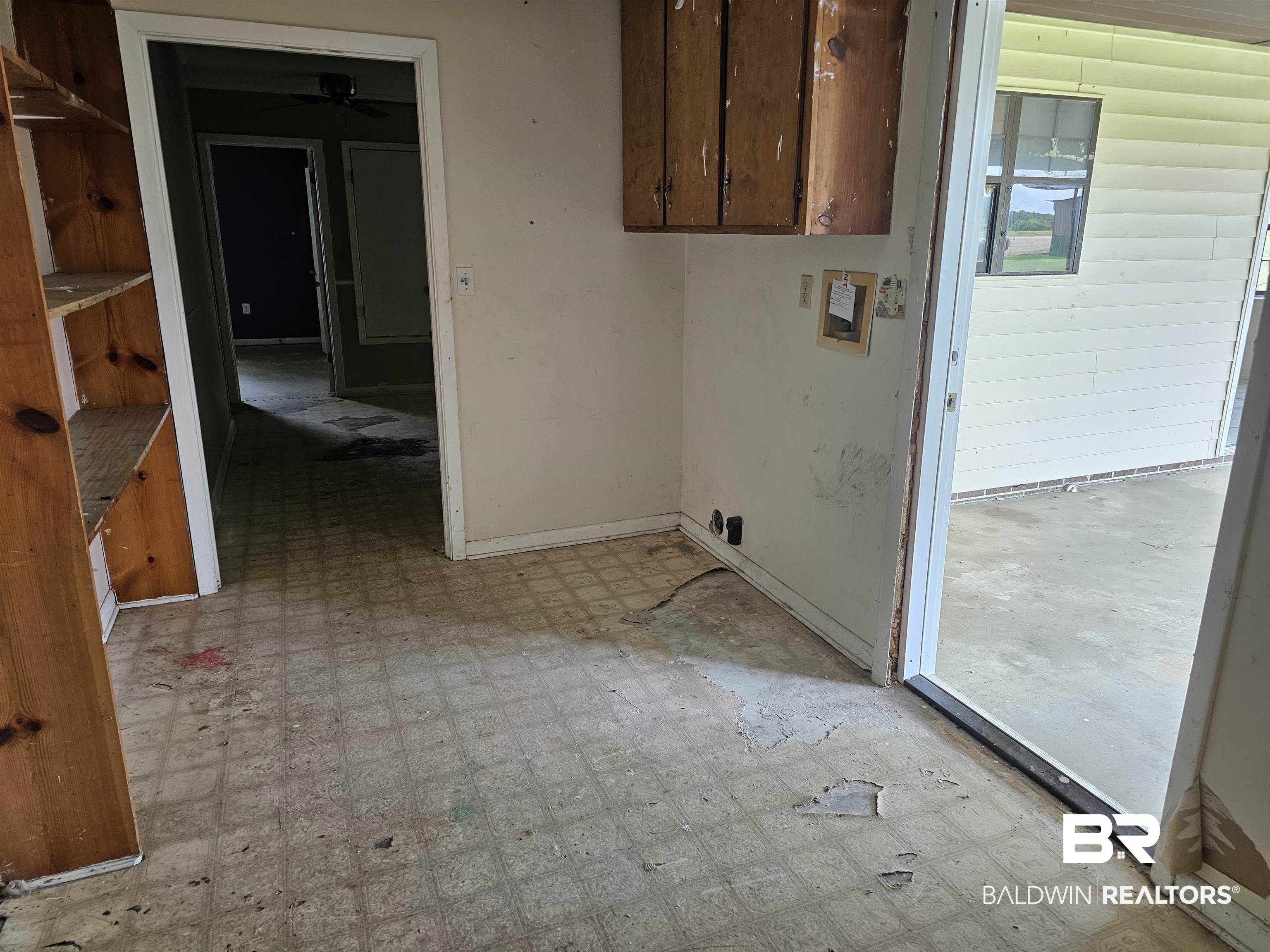 59575 Lottie Road Atmore, AL 36502 - Photo 15 of 23 Clothes washing area featuring a wealth of natural light, light floors, baseboards, and a ceiling fan