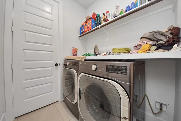 a bathroom with a tub sink shower and mirror