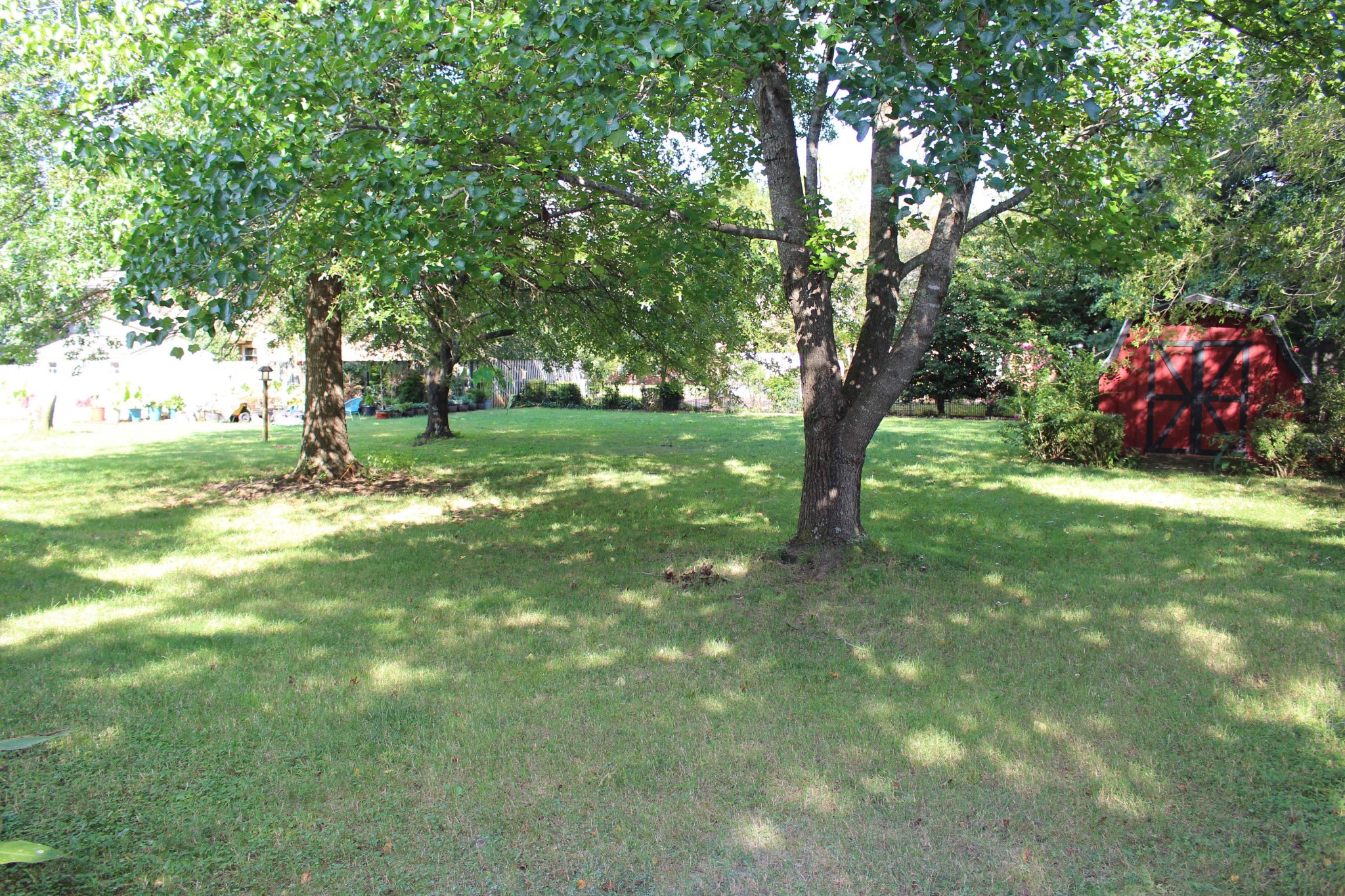 3114 Chanda Lane Murfreesboro, TN 37129 - Photo 4 of 13 a backyard of a house with table and chairs