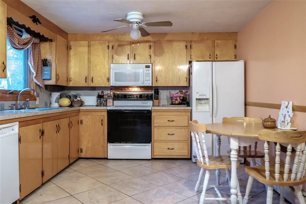Roomy Kitchen with White Appliances