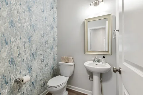 a large kitchen with stainless steel appliances granite countertop a lot of counter space a sink and a refrigerator