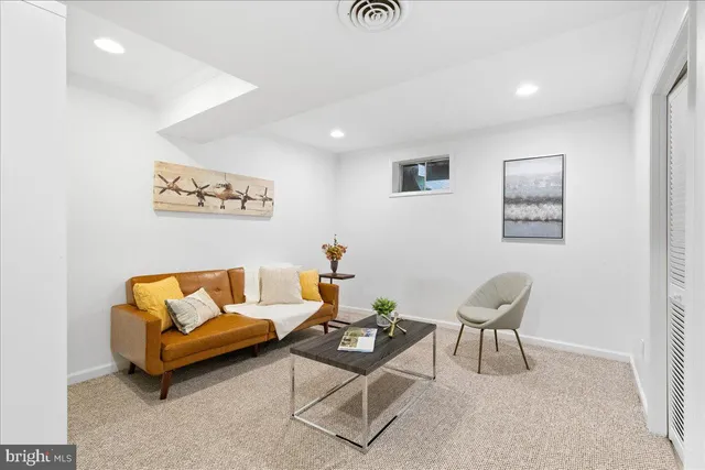 a living room with furniture and a rug