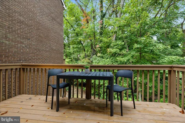 a view of a two chairs and table in the balcony